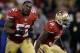 San Francisco 49ers Patrick Willis (52) and Donte Whitner celebrate after teammate NaVorro Bowman made an 89-yard touchdown in the fourth quarter of an NFL football game against the Atlanta Falcons in San Francisco, Monday, Dec. 23, 2013. (AP Photo/Marcio Jose Sanchez)