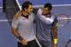 MELBOURNE, AUSTRALIA - JANUARY 23: Roger Federer of Switzerland and Jo-Wilfred Tsonga of France shake hands after Federer won their Quarterfinal match during day ten of the 2013 Australian Open at Melbourne Park on January 23, 2013 in Melbourne, Australia. (Photo by Robert Prezioso/Getty Images)