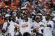 The Denver Broncos celebrate with the trophy after the AFC Championship NFL playoff football game against the New England Patriots in Denver, Sunday, Jan. 19, 2014. The Broncos defeated the Patriots 26-16 to advance to the Super Bowl. (AP Photo/Julie Jacobson)