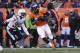 Denver Broncos tight end Julius Thomas (80) comes down with a pass against the San Diego Chargers in the first quarter of an NFL AFC division playoff football game, Sunday, Jan. 12, 2014, in Denver. (AP Photo/Charlie Riedel)