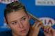 Maria Sharapova of Russia answers questions during a press conference following her fourth round loss to Dominika Cibulkova of Slovakia at the Australian Open tennis championship in Melbourne, Australia, Monday, Jan. 20, 2014. (AP Photo/Shuji Kajiyama Shuji)