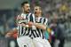 Juventus forward Mirko Vucinic, of Montenegro, left, celebrate with his teammate Leonardo Bonucci after he scored during a Serie A soccer match between Juventus and AS Roma, at the Juventus stadium, in Turin, Italy, Sunday, Jan. 5, 2014. (AP Photo/Massimo Pinca)