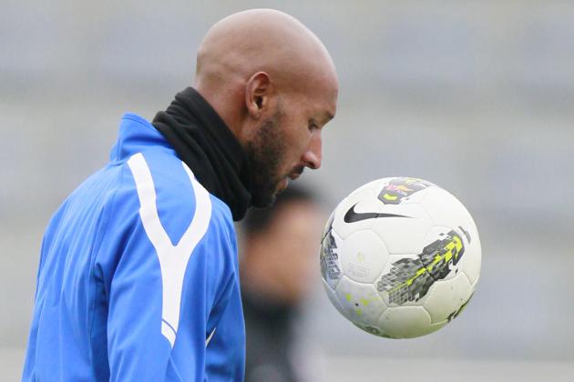 French striker Nicolas Anelka of Shanghai Shenhua warms up before a training soccer match against Nanchang Hengyuan in Shanghai, China, Saturday Feb. 25, 2012. Anelka joined Chinese Super League club Shanghai Shenhua in January on a transfer from Chelsea. (AP Photo/Eugene Hoshiko)