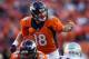 Jan 19, 2014; Denver, CO, USA; Denver Broncos quarterback Peyton Manning (18) signals at the line of scrimmage in the second half against the New England Patriots during the 2013 AFC championship playoff football game at Sports Authority Field at Mile High. Mandatory Credit: Chris Humphreys-USA TODAY Sports
