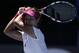 Li Na of China follows through on a shot to Eugenie Bouchard of Canada during their semifinal at the Australian Open tennis championship in Melbourne, Australia, Thursday, Jan. 23, 2014.(AP Photo/Rick Rycroft)