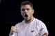 Stanislas Wawrinka of Switzerland celebrates a point won against Tomas Berdych of the Czech Republic during their semifinal at the Australian Open tennis championship in Melbourne, Australia, Thursday, Jan. 23, 2014.(AP Photo/Rick Rycroft)