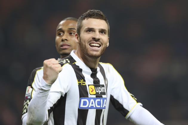 Udinese defender Thomas Heurtaux, of France, celebrates after winning the Italian Cup soccer match between AC Milan and Udinese at the San Siro stadium in Milan, Italy, Wednesday, Jan. 22, 2014. Udinese won 2-1. (AP Photo/Antonio Calanni)