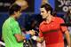MELBOURNE, AUSTRALIA - JANUARY 26: Roger Federer of Switzerland and Rafael Nadal of Spain embrace at the net after their semifinal match during day eleven of the 2012 Australian Open at Melbourne Park on January 26, 2012 in Melbourne, Australia. (Photo by Lucas Dawson/Getty Images)