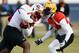 Jan 20, 2014; Fairhope, AL, USA; South Squad running back Antonio Andrews of Western Kentucky (5) carries the ball against South Squad safety Craig Loston of LSU (6) during practice at Fairhope Municipal Stadium. Mandatory Credit: John David Mercer-USA TODAY Sports