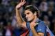 Roger Federer of Switzerland walks off the Rod Laver Arena after his semifinal loss to Rafael Nadal of Spain during their semifinal at the Australian Open tennis championship in Melbourne, Australia, Friday, Jan. 24, 2014.(AP Photo/Andrew Brownbill)