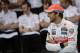 McLaren Mercedes driver Jenson Button, of Britain, smiles before an official team photo at the Interlagos race track in Sao Paulo, Brazil, Saturday, Nov. 23, 2013. The Brazilian Formula One Grand Prix will take place on Sunday. (AP Photo/Felipe Dana)