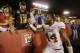 Texas defensive end Jackson Jeffcoat (44) celebrates with fans after his team's 31-30 victory over Iowa State in an NCAA college football game, Thursday, Oct. 3, 2013, in Ames, Iowa. (AP Photo/Charlie Neibergall)