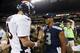 ADVANCE FOR WEEKEND EDITIONS, JAN. 25-26 - FILE - In this Aug. 17, 2013, file photo, Seattle Seahawks quarterback Russell Wilson (3) shakes hands with Denver Broncos quarterback Peyton Manning, left, after the Seahawks beat the Broncos 40-10 in preseason NFL football game in Seattle. The two teams are slated to meet in Super Bowl XLVIII on Sunday, Feb. 2, 2014, in East Rutherford, N.J. (AP Photo/John Froschauer, File)