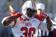 South defensive end Dee Ford (30), of Auburn, celebrates after a sack of the North quarterback during the first half of the Senior Bowl NCAA college football game on Saturday, Jan. 25, 2014, in Mobile, Ala. (AP Photo/Butch Dill)