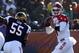 South quarterback Derek Carr (4), of Fresno St., rolls out to pass away from the pressure of North line backer Michael Sam (55), of Missouri, during the first half of the Senior Bowl NCAA college football game on Saturday, Jan. 25, 2014, in Mobile, Ala. (AP Photo/Butch Dill)