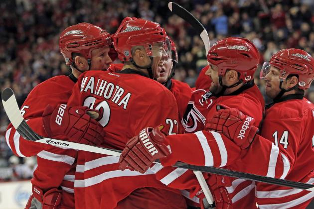 Carolina Hurricanes' Manny Malhotra (22) is congratulated by teammates after scoring in the second period of an NHL hockey game against the Ottawa Senators in Raleigh, N.C., Saturday, Jan. 25, 2014. Hurricanes won 6-3. (AP Photo/Karl B DeBlaker)