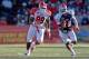 Jan 25, 2014; Mobile, AL, USA; North squad quarterback Tajh Boyd of Clemson (10) runs from South squad defensive end I.K. Enemkpali of Louisiana Tech (99) during the first half of a game at Ladd-Peebles Stadium. Mandatory Credit: Derick E. Hingle-USA TODAY Sports