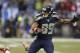 Seattle Seahawks' Doug Baldwin (89) runs a ball against the San Francisco 49ers during the first half of the NFL football NFC Championship game Sunday, Jan. 19, 2014, in Seattle. (AP Photo/Elaine Thompson)