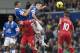 Everton's Philip Jagielka, upper left, and Leon Osman, upper centre, head the ball away from Liverpool's Luis Suarez, lower centre left, during their English Premier League soccer match at Goodison Park Stadium, Liverpool, England, Saturday Nov. 23, 2013. (AP Photo/Jon Super)