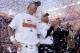 ADVANCE FOR WEEKEND EDITIONS, JAN. 25-26 - In this Jan. 19, 2014, file photo, Denver Broncos quarterback Peyton Manning, stands with head coach John Fox and Broncos vice president John Elway during the trophy ceremony after the AFC Championship NFL playoff football game in Denver. When he faces the Seattle Seahawks next Sunday, Manning can become the first starting quarterback to win the Super Bowl with two franchises. (AP Photo/Charlie Riedel, File)