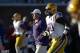LSU defensive tackle Anthony Johnson (90) runs drills with teammates and football coach Les Miles during pregame drills before playing Mississippi in their NCAA college football game at Vaught-Hemingway Stadium in Oxford, Miss., Saturday, Oct. 19, 2013. Mississippi won 27-24. (AP Photo/Rogelio V. Solis)