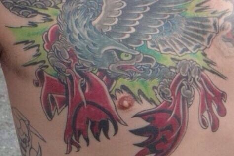 seattle fan has legion of boom tattoo of a seahawk trashing a