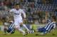 Real Madrid's Cristiano Ronaldo, from Portugal, center, duels for the ball against Espanyol's Jordi Forlin, right, during a Spanish La Liga soccer match at Cornella-El Prat stadium in Cornella Llobregat, Spain, Saturday, May 11, 2013. (AP Photo/Manu Fernandez)