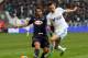 Marseille's French midfielder Florian Thauvin, right, in action with Bordeaux's French defender Marc Planus, during their League One soccer match, at the Velodrome Stadium, in Marseille, southern France, Sunday, Dec. 22, 2013. (AP Photo/Claude Paris)