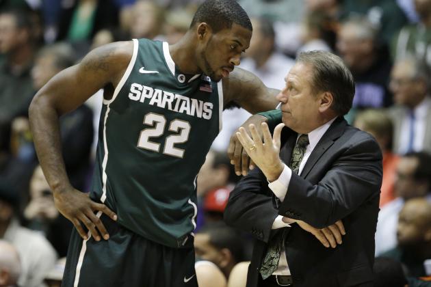 Michigan State guard Branden Dawson, left, listens to head coach Tom Izzo during the second half of an NCAA college basketball game against Northwestern in Evanston, Ill., on Wednesday, Jan. 15, 2014. Michigan State won 54-40. (AP Photo/Nam Y. Huh)