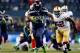 SEATTLE, WA - JANUARY 19: Running back Marshawn Lynch #24 of the Seattle Seahawks carries the ball against the San Francisco 49ers during the 2014 NFC Championship at CenturyLink Field on January 19, 2014 in Seattle, Washington. (Photo by Jonathan Ferrey/Getty Images)