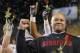 Stanford head coach David Shaw holds a rose after the NCAA Pac-12 Championship football game, Saturday, Dec. 7, 2013, in Tempe, Ariz. Stanford defeated Arizona State 38-14.(AP Photo/Matt York)