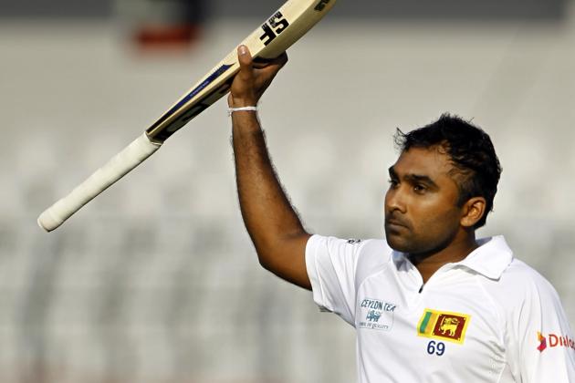 Sri Lanka's Mahela Jayawardene acknowledges the crowd after scoring a double century on the third day of the first test cricket match against Bangladesh in Dhaka, Bangladesh, Wednesday, Jan. 29, 2014. (AP Photo/A.M. Ahad)