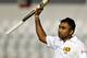 Sri Lanka's Mahela Jayawardene acknowledges the crowd after scoring a double century on the third day of the first test cricket match against Bangladesh in Dhaka, Bangladesh, Wednesday, Jan. 29, 2014. (AP Photo/A.M. Ahad)