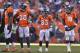 ADVANCE FOR WEEKEND EDITIONS, JAN. 25-26 - In this Jan. 12, 2014, file photo, Denver Broncos tight end Julius Thomas (80), wide receiver Demaryius Thomas (88), wide receiver Wes Welker (83) and quarterback Peyton Manning (18) wait as officials review a fumbled pass by Thomas during the second quarter against the San Diego Chargers in an AFC divisional NFL playoff football game in Denver. No team in the 93-year history of the NFL ever had that many players catch at least 60 passes or reach the end zone 10 or more times until the Broncos put up a record 606 points. (AP Photo/Jack Dempsey, File)