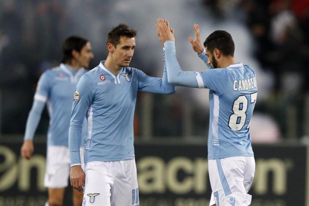 Lazio midfielder Antonio Candreva, right, celebrates woith teammate Miroslav Klose, of Germany, after scoring on a penalty kick during a Serie A soccer match between Lazio and Juventus, at Rome's Olympic stadium, Saturday, Jan. 25, 2014. (AP Photo/Riccardo De Luca)