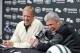 New York Jets coach Rex Ryan, right, and general manager John Idzik react as they speak to the media during an NFL football news conference Tuesday, Dec. 31, 2013, in Florham Park, N.J. (AP Photo/Bill Kostroun)