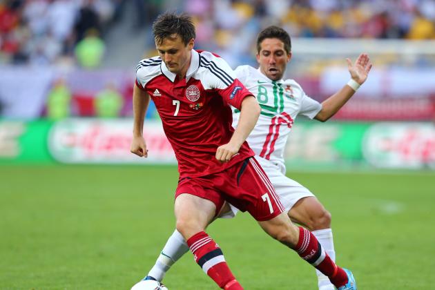 L'VIV, UKRAINE - JUNE 13:  William Kvist of Denmark is put under pressure by Joao Moutinho of Portugal during the UEFA EURO 2012 group B match between Denmark and Portugal at Arena Lviv on June 13, 2012 in L'viv, Ukraine.  (Photo by Martin Rose/Getty Images)