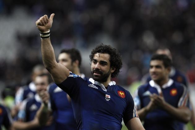 France's Yoann Huget gestures to celebrate his team's victory against England, during their Six Nations rugby union international match, at the Stade de France, in Saint Denis, outside Paris, Saturday, Feb 1, 2014. France defeated England 26-24. (AP Photo/Thibault Camus)