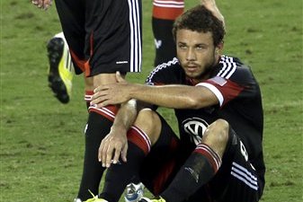 D.C. United's Branko Boskovic (8) pats the head of Nick DeLeon after losing to the Houston Dynamo in an MLS Eastern Conference Championship soccer game, Sunday, Nov. 11, 2012, in Houston. The Dynamo defeated D.C. United 3-1. (AP Photo/David J. Phillip)