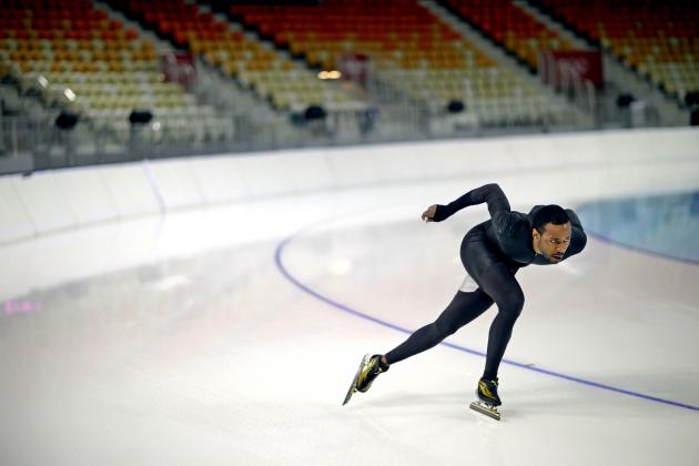United States long track speed skater Shani Davis glides around a turn as he practices in Adler Arena for the 2014 Winter Olympics, Friday, Jan. 31, 2014, in Sochi, Russia. (AP Photo/David Goldman)
