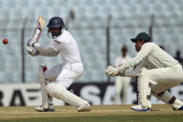 Sri Lanka’s Kumar Sangakkara, left, plays a shot as Bangladesh’s Shamsur Rahman keeps wicket on the second day of the second test cricket match in Chittagong, Bangladesh, Wednesday, Feb. 5, 2014. Sangakkara reached his maiden test triple-century on Wednesday to lead Sri Lanka to a mammoth first innings lead of 501 on the second day. He became the third Sri Lanka player to score a triple-century, joining Mahela Jayawardene and Sanath Jayasuriya.(AP Photo)