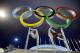 Russian dancers who will be performing at the opening ceremony pose with the Olympic rings as their friend photographs them, ahead of the 2014 Winter Olympics, Thursday, Feb. 6, 2014, in Sochi, Russia. (AP Photo/Wong Maye-E)