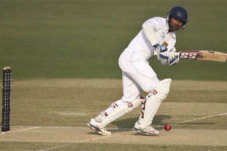 FILE - In this Tuesday, Feb. 4, 2014 file photo, Sri Lanka’s Kumar Sangakkara plays a shot on the first day of the second test cricket match against Bangladesh in Chittagong, Bangladesh. Kumar Sangakkara reached his maiden test triple-century on Wednesday Feb. 5, 2014 to lead Sri Lanka to a mammoth first innings lead of 501 on the second day of the second test against Bangladesh. (AP Photo, File)