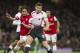 Arsenal's Laurent Koscielny fights for the ball with Liverpool's Steven Gerrard, during their English Premier League soccer match, at the Emirates Stadium, in London, Saturday, Nov. 2, 2013. (AP Photo / Bogdan Maran)