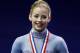 Gracie Gold holds her gold medal on the podium at the women's skating awards ceremony at the U.S. Figure Skating Championships in Boston, Saturday, Jan. 11, 2014. (AP Photo/Elise Amendola)