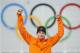Sven Kramer of the Netherlands celebrates after winning the gold in the men's 5,000-meter speedskating race during the flower ceremony at the Adler Arena Skating Center during the 2014 Winter Olympics in Sochi, Russia, Saturday, Feb. 8, 2014. Kramer set a new Olympic record. (AP Photo/Pavel Golovkin)