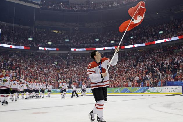 Canada's Sidney Crosby (87) waves a Canadian flag after the men's ice hockey medal ceremony at the Vancouver 2010 Olympics in Vancouver, British Columbia, Sunday, Feb. 28, 2010.  (AP Photo/Matt Slocum)