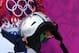SOCHI, RUSSIA - FEBRUARY 09: Jenny Jones of Great Britain holds the cracked helmet of Sarka Pancochova of Czech Republic after Pancochova fell in the Women's Snowboard Slopestyle Finals during day two of the Sochi 2014 Winter Olympics at Rosa Khutor Extreme Park on February 9, 2014 in Sochi, Russia. (Photo by Cameron Spencer/Getty Images)
