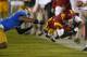 Southern California wide receiver Marqise Lee, right, dives for extra yards as UCLA cornerback Anthony Jefferson defends during the second half of an NCAA college football game, Saturday, Nov. 30, 2013, in Los Angeles. UCLA won 35-14. (AP Photo/Mark J. Terrill)
