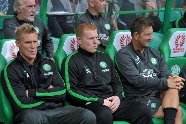 GLASGOW, SCOTLAND - AUGUST 03: Celtic manager Neil Lennon (centre) in the dugout with assistants Johan Mjallby (left) and Garry Parker (right) at the start of the Scottish Premier League game between Celtic and Ross County at Celtic Park Stadium on August 03, 2013 in Glasgow, Scotland. (Photo by Mark Runnacles/Getty Images)